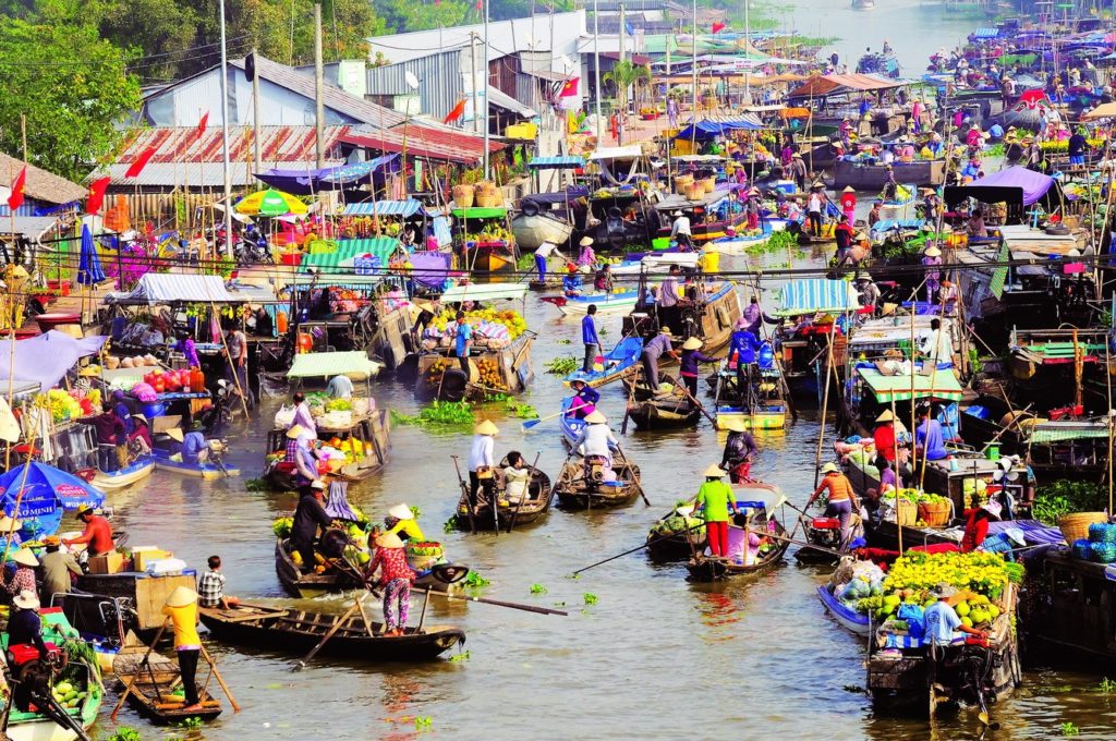 When to avoid riding motorbikes to Mekong Delta in Vietnam? floating market on mekong delta 2 1024x680 - When to avoid riding motorbikes to Mekong Delta in Vietnam?